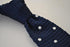 navy blue skinny knitted tie with white polka dots